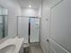 Bathroom with glass shower doors and vanity at 6300 Chirpine Ln, St Cloud, FL 34771