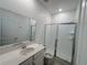 Bathroom with glass shower doors and vanity at 6300 Chirpine Ln, St Cloud, FL 34771