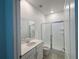 Bathroom with glass shower doors and vanity at 6300 Chirpine Ln, St Cloud, FL 34771