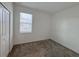 A bedroom featuring carpeted floors and a window for natural light at 6300 Chirpine Ln, St Cloud, FL 34771