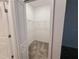 A walk-in closet with carpeted floors and shelving for storage solutions at 6300 Chirpine Ln, St Cloud, FL 34771