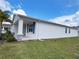 Inviting exterior view of home, showcasing its well-manicured lawn and charming architectural details at 6300 Chirpine Ln, St Cloud, FL 34771