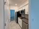 Modern kitchen with stainless steel appliances, sleek countertops, and ample cabinet space at 6300 Chirpine Ln, St Cloud, FL 34771