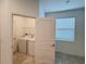 Bright laundry room featuring modern machines and window offering plenty of natural light at 6300 Chirpine Ln, St Cloud, FL 34771