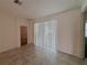 Bright room featuring tile flooring and a large window at 6300 Chirpine Ln, St Cloud, FL 34771