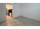 Open layout living room leading to a kitchen, featuring stainless steel appliances and ample cabinet space at 6300 Chirpine Ln, St Cloud, FL 34771