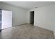 Spacious living room showcasing neutral tile flooring and open layout, perfect for comfortable living at 6300 Chirpine Ln, St Cloud, FL 34771