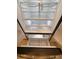 Interior view of the stainless steel refrigerator with adjustable shelves at 6300 Chirpine Ln, St Cloud, FL 34771