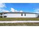 Side view of a single-Gathering home with a well maintained lawn at 6300 Chirpine Ln, St Cloud, FL 34771
