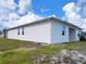 Side view of a single-Gathering home with solar panels and a well maintained lawn at 6300 Chirpine Ln, St Cloud, FL 34771