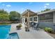 Inviting backyard oasis with a refreshing pool, pergola, and comfortable outdoor seating at 811 Oregon St, Orlando, FL 32803
