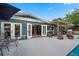 Outdoor living space with a pool, patio, pergola, and access to the home's interior at 811 Oregon St, Orlando, FL 32803