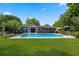 Backyard with a pool, pergola, and patio area perfect for outdoor entertaining and relaxation at 811 Oregon St, Orlando, FL 32803