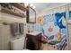 Cozy bathroom with wooden shelves, stylish floral shower curtain, and a modern vanity at 811 Oregon St, Orlando, FL 32803