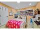 Cozy bedroom with colorful decor, wood floors, and built-in shelving at 811 Oregon St, Orlando, FL 32803