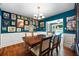 Bright dining room with gallery wall and wooden table, great for hosting gatherings and displaying art at 811 Oregon St, Orlando, FL 32803
