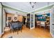 Dining room featuring exposed brick wall and hardwood floors with an open floor plan at 811 Oregon St, Orlando, FL 32803