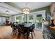 Dining room with wood floors and doors that lead to the outdoor pool area at 811 Oregon St, Orlando, FL 32803