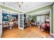 Spacious living room with hardwood floors and access to other rooms through white framed doors at 811 Oregon St, Orlando, FL 32803