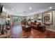 Bright living room showcasing hardwood floors, a cozy fireplace, and large windows providing ample natural light at 811 Oregon St, Orlando, FL 32803