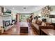 Inviting living room with a brick fireplace, hardwood floors, and a comfortable seating area with lots of natural light at 811 Oregon St, Orlando, FL 32803