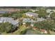 Resort-style living: Aerial view showcases community pool and amenities at Legacy Dunes at 8816 Dunes Ct # 303, Kissimmee, FL 34747
