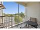 Outdoor balcony offering a seating area and a peaceful neighborhood view at 8816 Dunes Ct # 303, Kissimmee, FL 34747