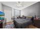 Bedroom featuring a comfortable bed, closet, tv and plenty of natural light at 8816 Dunes Ct # 303, Kissimmee, FL 34747