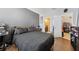 Bedroom boasts wood-look flooring and an ensuite bathroom at 8816 Dunes Ct # 303, Kissimmee, FL 34747