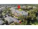 Well-situated, bright, and inviting apartment building with a well-manicured lawn and a backdrop of lush, mature trees at 8816 Dunes Ct # 303, Kissimmee, FL 34747