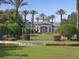 Beautiful Legacy Dunes entrance with lush landscaping and community signage at 8816 Dunes Ct # 303, Kissimmee, FL 34747