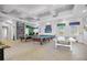 Spacious game room features pool tables, arcade games, and table tennis for hours of entertainment at 8816 Dunes Ct # 303, Kissimmee, FL 34747