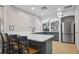 Kitchen featuring modern countertops and stainless steel refrigerator plus built in shelving at 8816 Dunes Ct # 303, Kissimmee, FL 34747