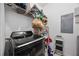 Functional laundry room with modern washer, shelving and necessary storage at 8816 Dunes Ct # 303, Kissimmee, FL 34747