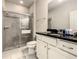 Bathroom featuring a shower, toilet, and sink with modern fixtures and white vanity at 8911 Geneve Ct, Kissimmee, FL 34747