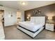 Bright Primary bedroom featuring a king bed with nightstands, accent wall and view to Primary bath at 8911 Geneve Ct, Kissimmee, FL 34747