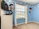 Whimsical ' room with Woody wall decor, light blue paint, and white trim for a playful atmosphere at 8911 Geneve Ct, Kissimmee, FL 34747