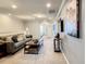 Upstairs Bonus room features comfy seating, TV and view to hallway at 8911 Geneve Ct, Kissimmee, FL 34747