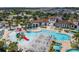 An aerial view of the large community pool and amenities including a water slide and seating at 8911 Geneve Ct, Kissimmee, FL 34747