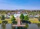 A scenic aerial view of the community pool, waterslide, and lazy river from the nearby pier at 8911 Geneve Ct, Kissimmee, FL 34747