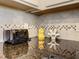 Close-up of the kitchen counter featuring stylish backsplash and modern appliances at 8911 Geneve Ct, Kissimmee, FL 34747