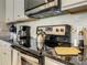 Kitchen details highlighting a stainless steel stovetop and complementary backsplash at 8911 Geneve Ct, Kissimmee, FL 34747