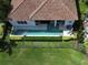 Aerial view of backyard featuring a long pool, manicured landscaping, and outdoor seating at 9979 Winnington St, Orlando, FL 32832