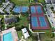 Aerial view of basketball and tennis courts next to pool and recreation areas at 9979 Winnington St, Orlando, FL 32832