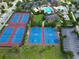 Aerial view of tennis and basketball courts with lush landscaping and community amenities at 9979 Winnington St, Orlando, FL 32832