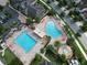 Aerial view of the community pool area showcasing a large pool, splash pad, and lounge area at 9979 Winnington St, Orlando, FL 32832