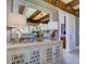 Hallway featuring a large mirror, decorative buffet, and views into the kitchen area at 9979 Winnington St, Orlando, FL 32832