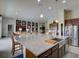 Bright kitchen with a large granite island, stainless steel appliances, and open layout at 9979 Winnington St, Orlando, FL 32832