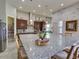 Gourmet kitchen with stainless steel appliances, granite countertops and center island at 9979 Winnington St, Orlando, FL 32832