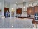 Modern kitchen with stainless steel appliances, granite countertops, and walk-in pantry at 9979 Winnington St, Orlando, FL 32832